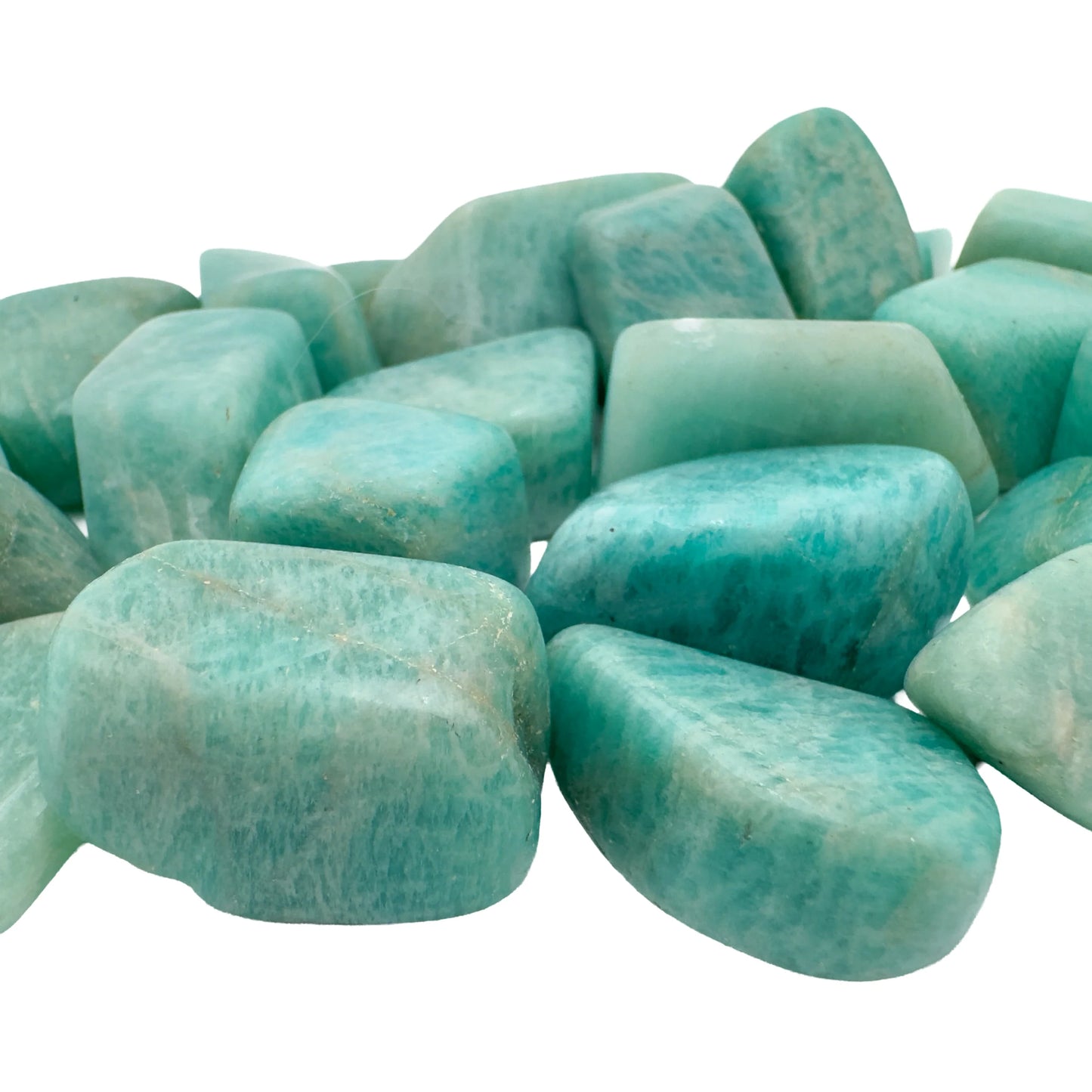 Bulk Amazonite tumbled stones piled together, blue-green polished crystals