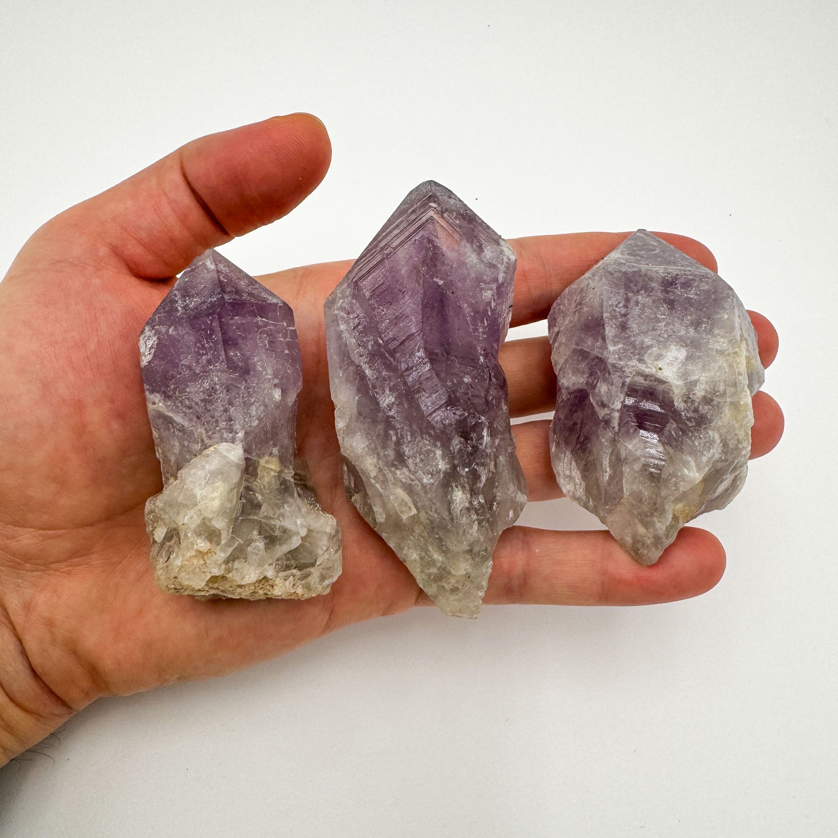 Top-down shot of purple Amethyst raw point, showing characteristic color.