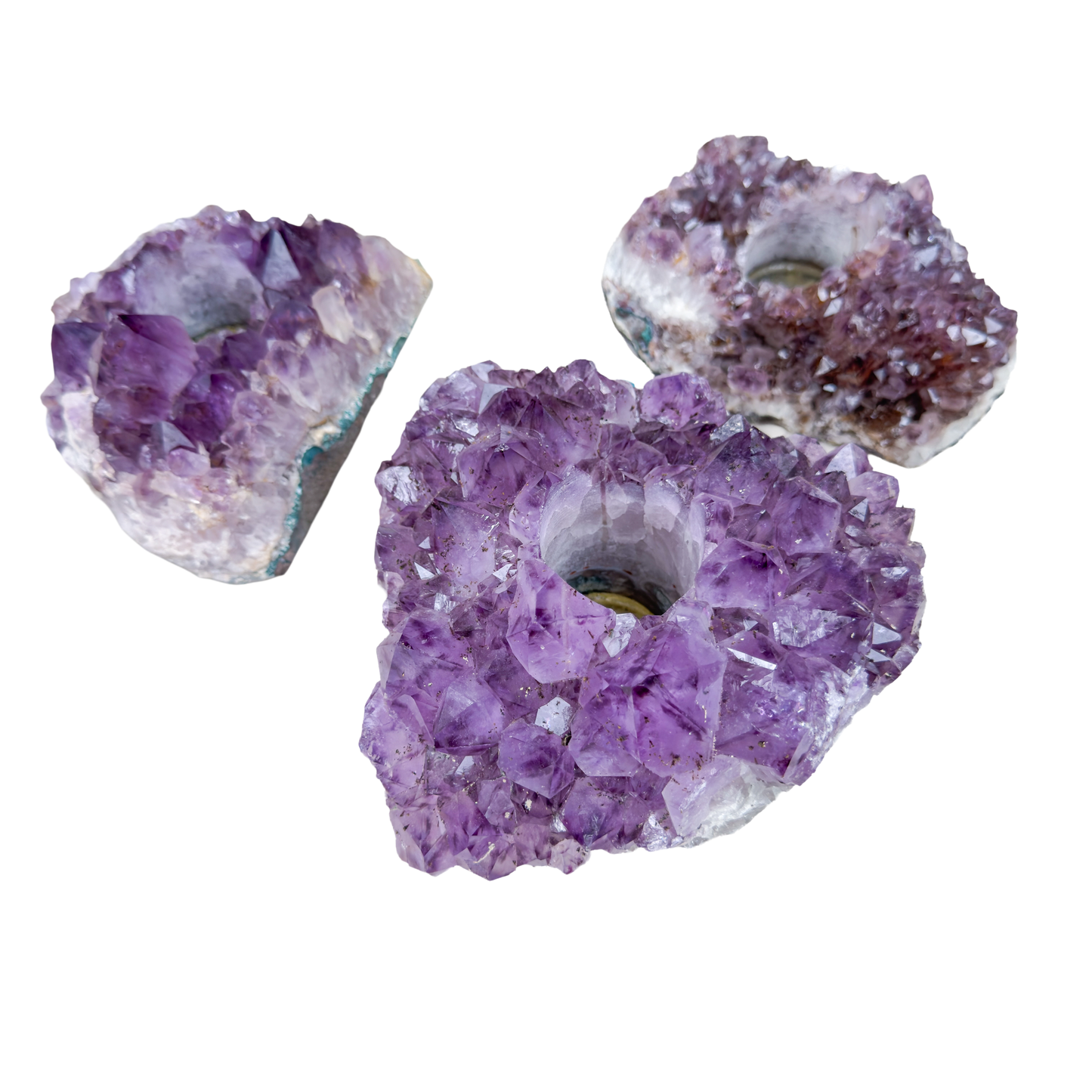 Three amethyst candle holders from Brazil, natural purple crystal clusters with drilled tea light wells