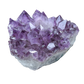 Deep purple amethyst candle holder with sharp crystal terminations around the tea light well