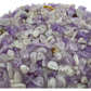 Amethyst chips scattered on surface, ethically sourced Madagascar quartz chips