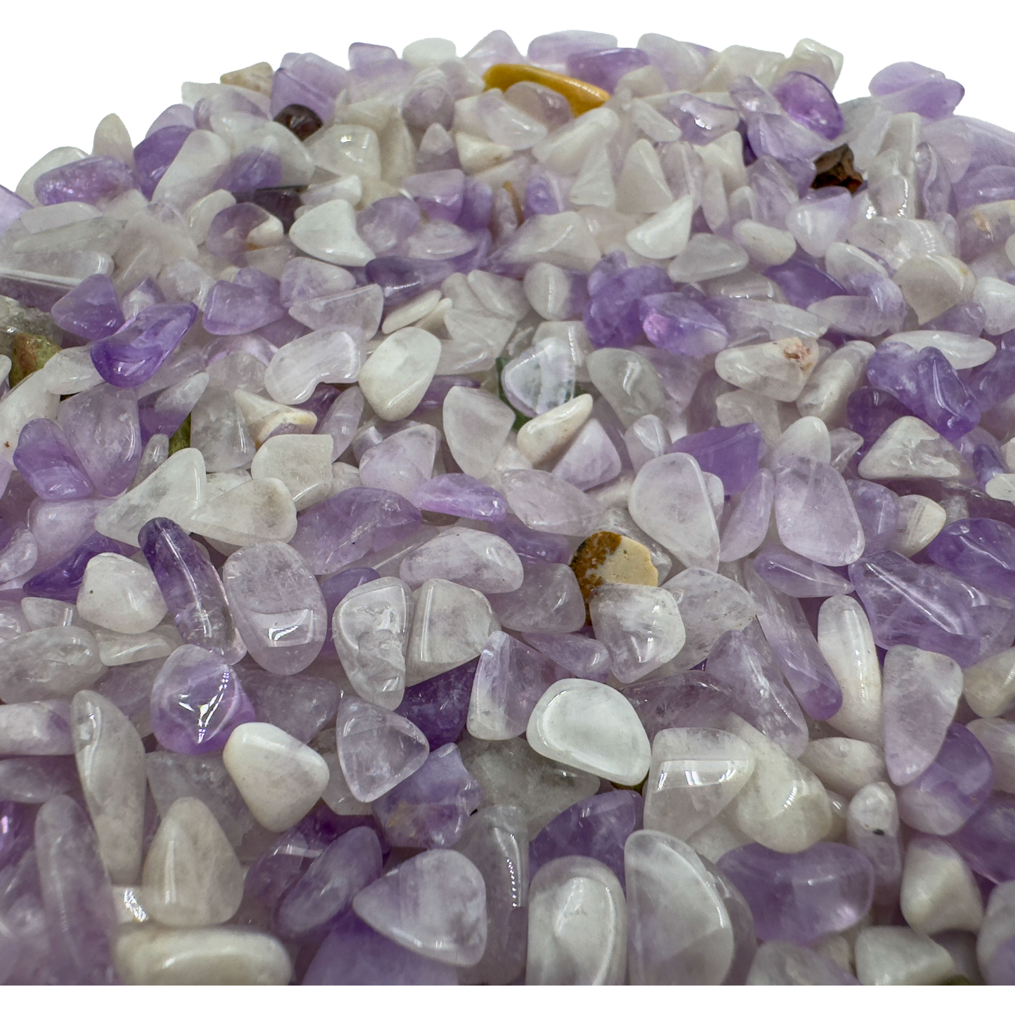 Amethyst chips scattered on surface, ethically sourced Madagascar quartz chips