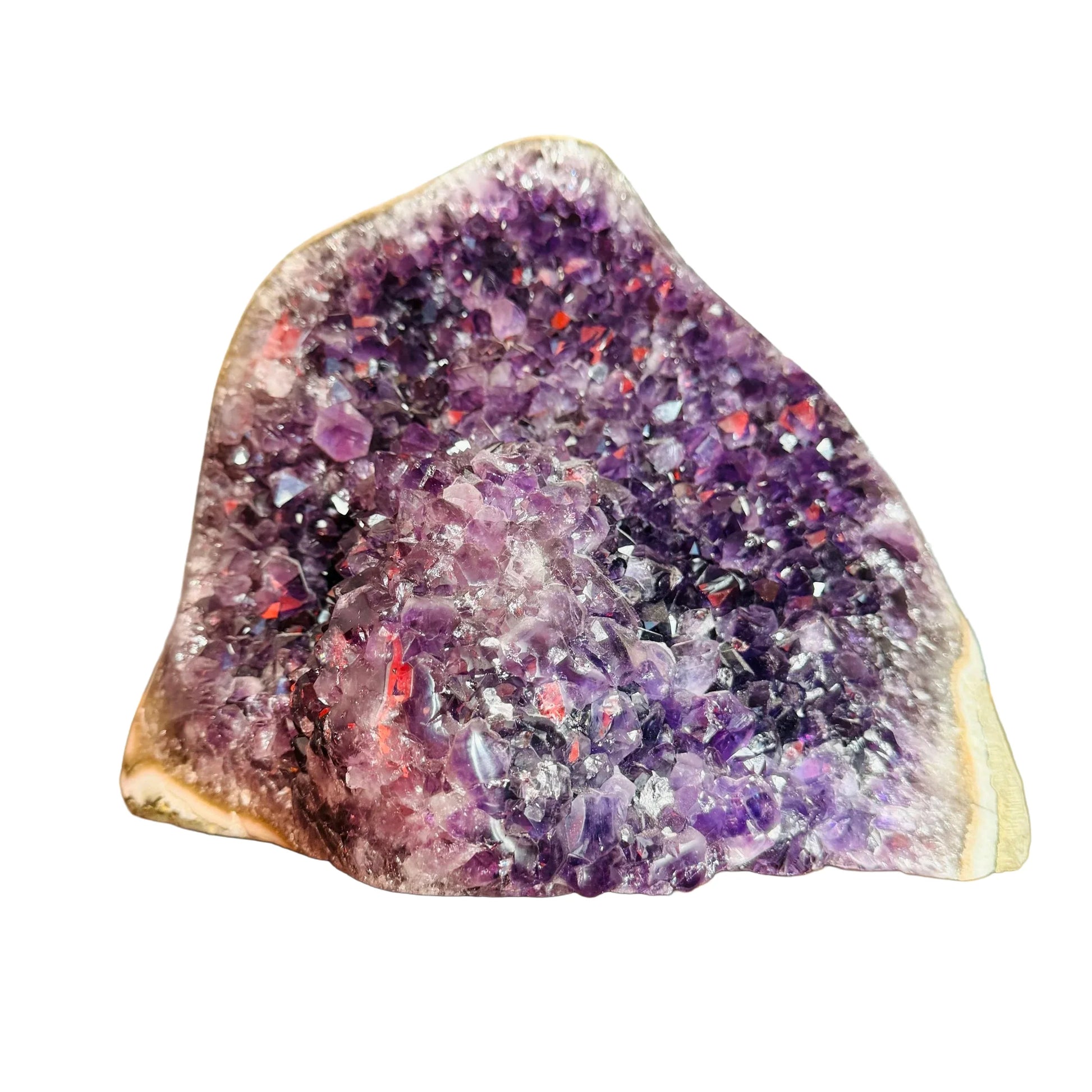 Grade aa amethyst geode held in hand for size reference