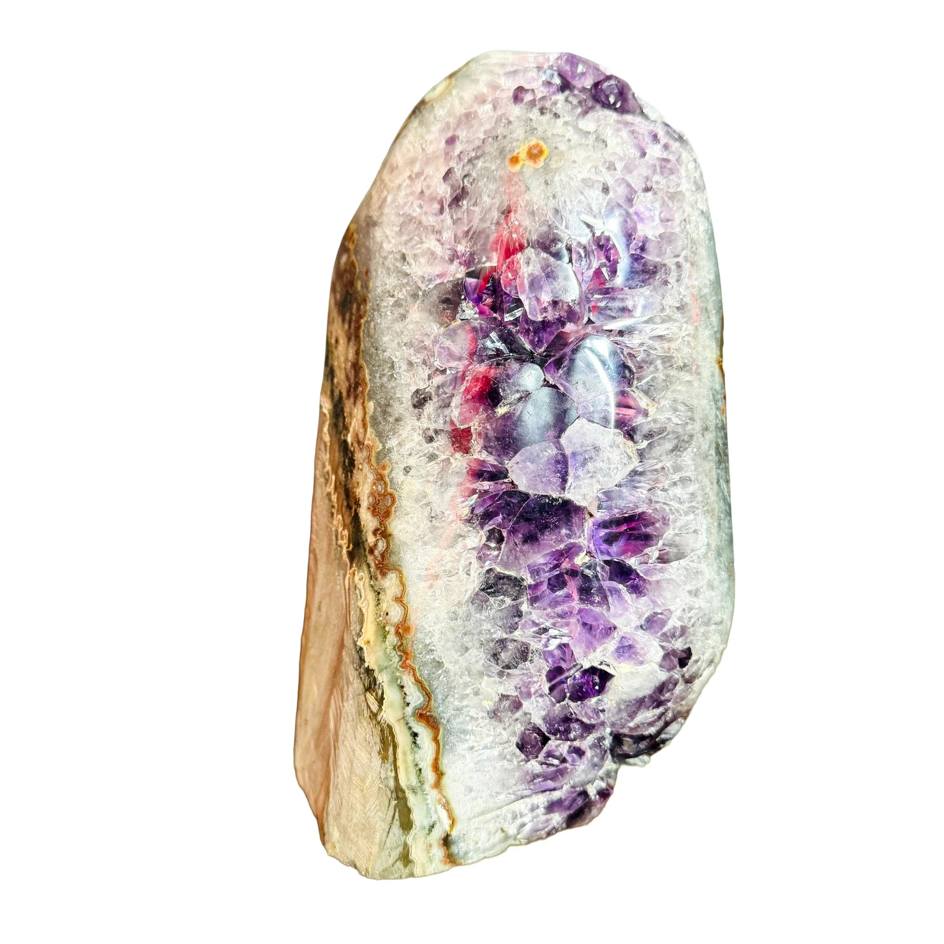 Grade aa amethyst geode held in hand for size reference