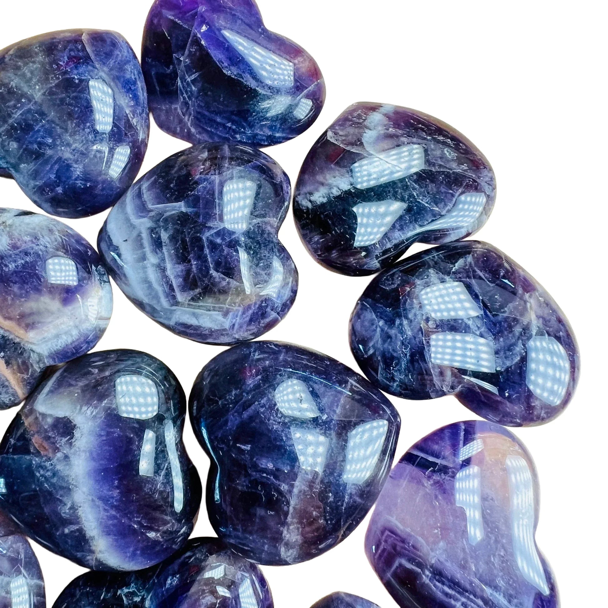 Bottom side of Amethyst polished heart, often kept for Stress Relief and Sleep, from Analamanga, Madagascar.