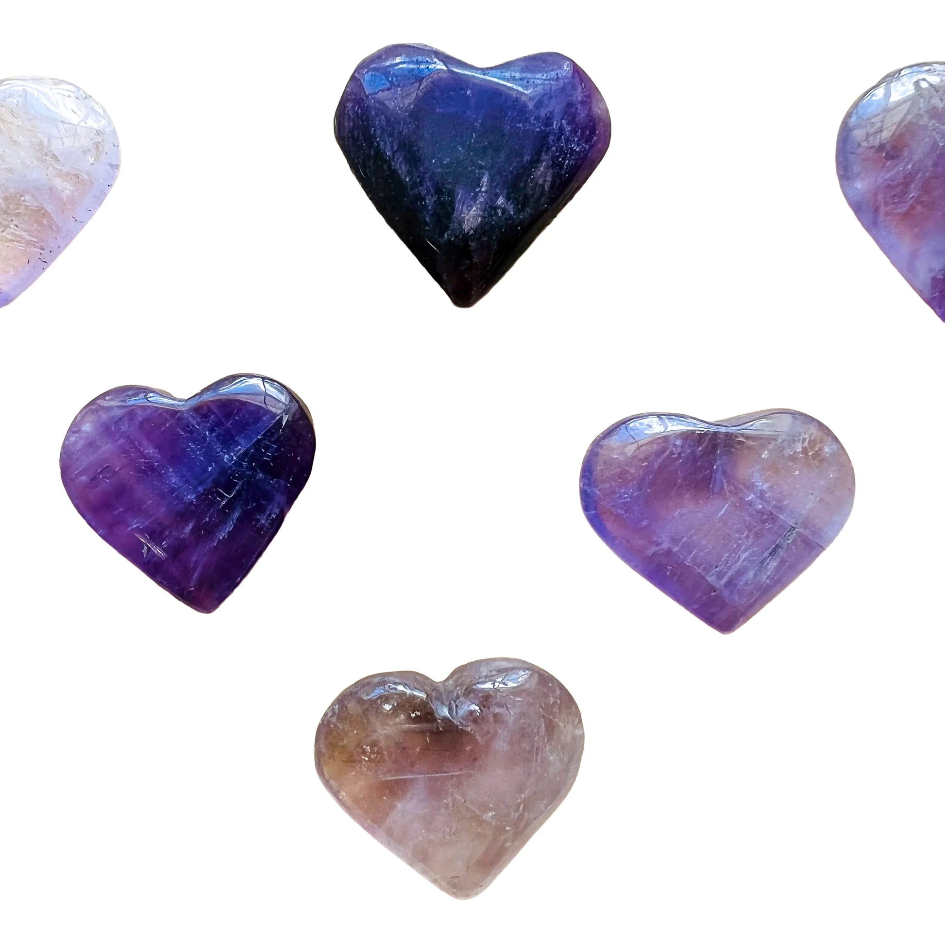 Overhead view of Amethyst polished heart, showing glassy finish, kept near for Stress Relief and Sleep.