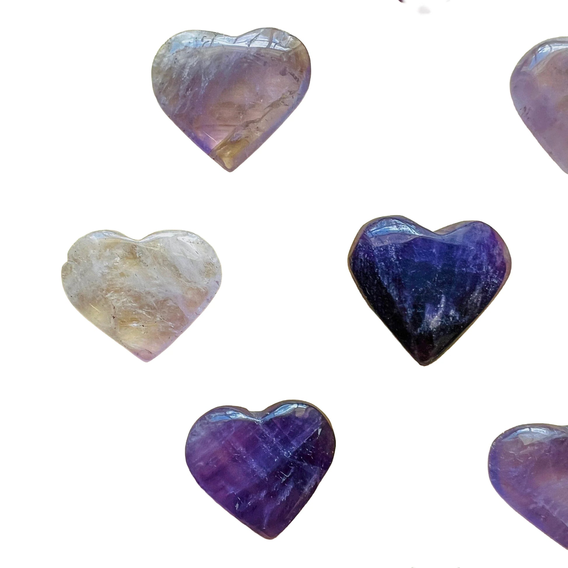 Reverse angle of Amethyst polished heart, hand-selected from Rio Grande do Sul, Brazil, showing characteristic color.