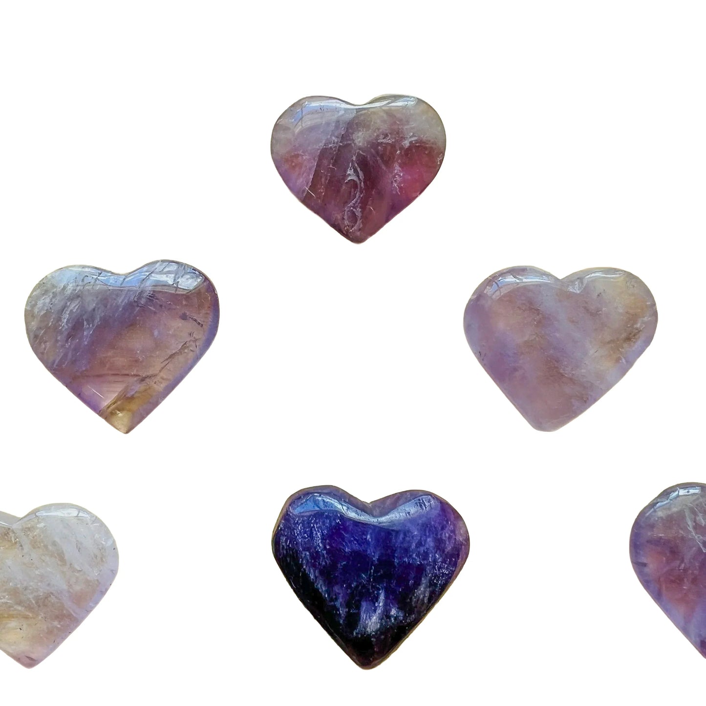 Palm-scale view of a single Amethyst polished heart Brazil-sourced, sourced from Rio Grande do Sul, Brazil.