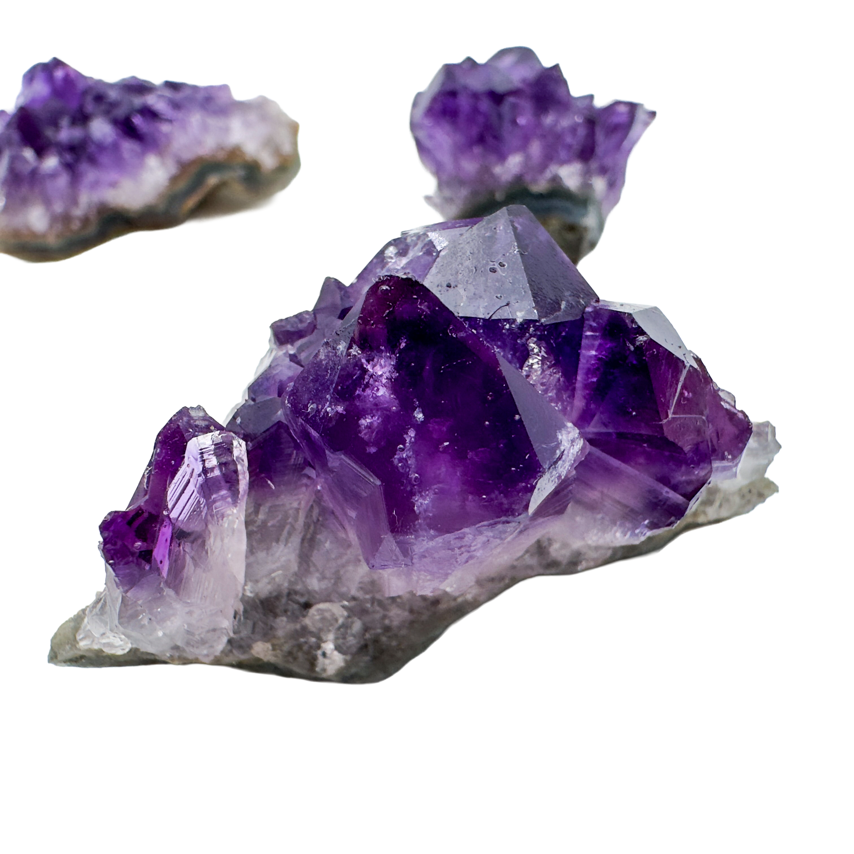 Variety of Uruguayan Amethyst clusters in deep saturated purple, formed in volcanic basalt geode cavities