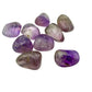 Tight crop on the polished surface of one Amethyst tumble, no dye and no coating
