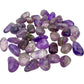 Angled view across pocket-size Amethyst tumbles with visible banding