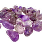 Overhead flat-lay of 1 to 1.5 inch Amethyst tumbles, 24 to 40 pieces a pound