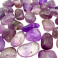 Amethyst tumbles showing the range from pale lavender to deep purple in one batch