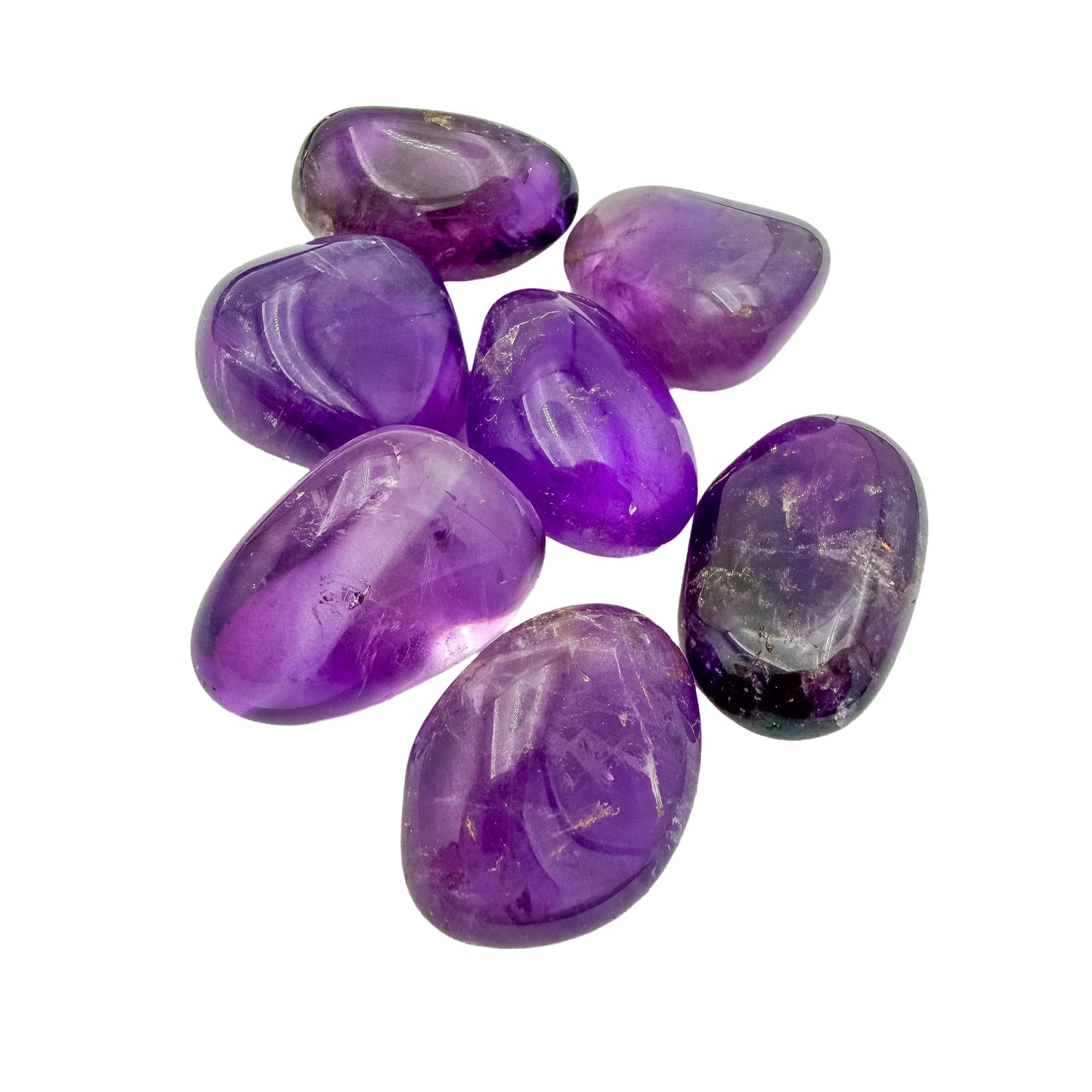 Side view of Ametrine tumbled stones showing polish and translucency