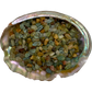 Texture-level view of Aquamarine polished chip, often kept for Courage, showing glassy finish.
