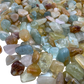 Top-side view of Grade A Aquamarine polished chip, from Huila, Angola, showing natural variation.