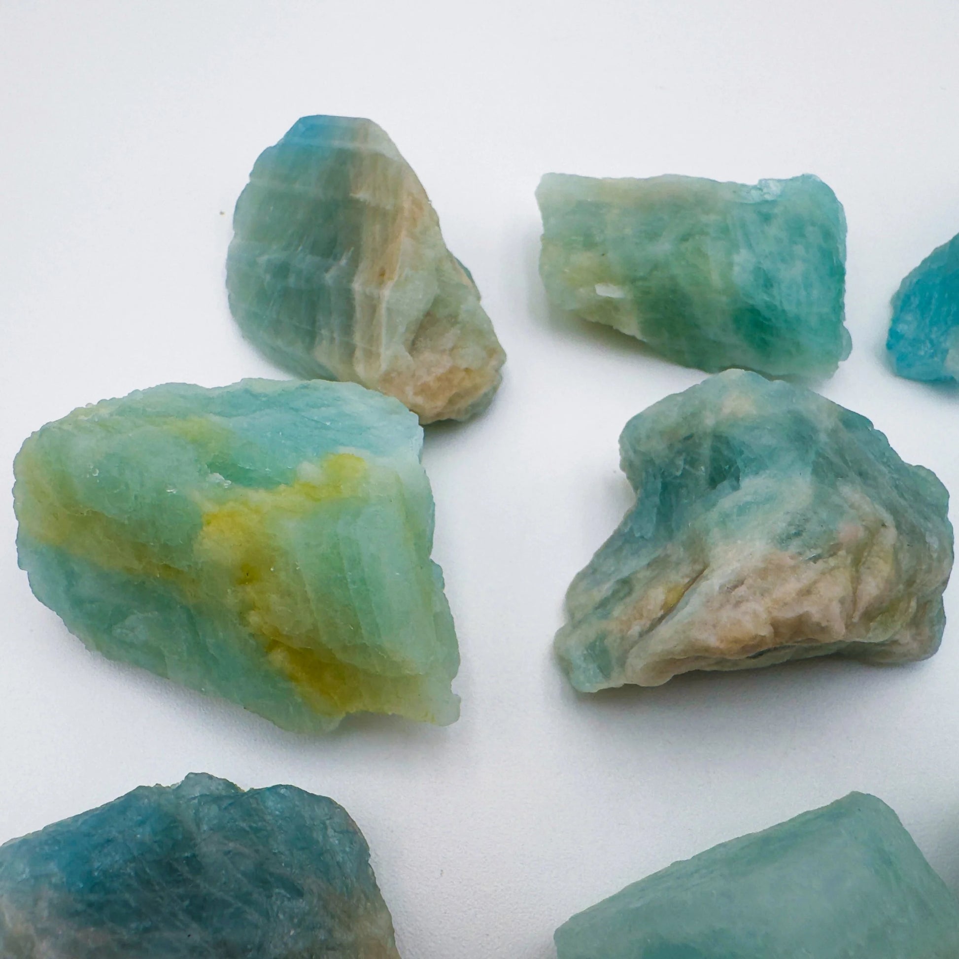 Grade aa aquamarine raw held in hand for size reference