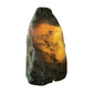 Green aventurine crystal lamp lit, warm green-gold glow through the stone