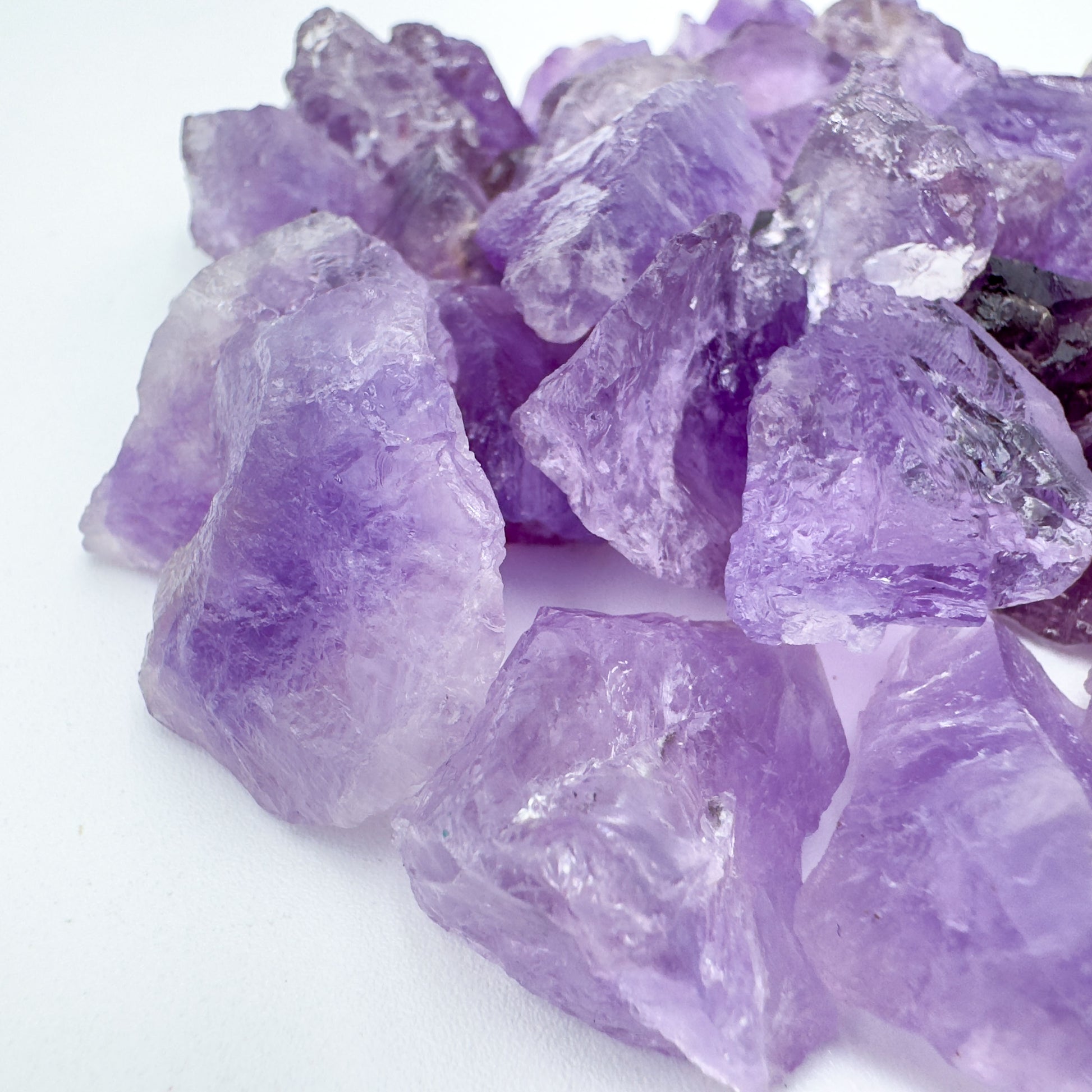 Edge view of Amethyst raw stone, showing characteristic finish, sourced from Brazil.