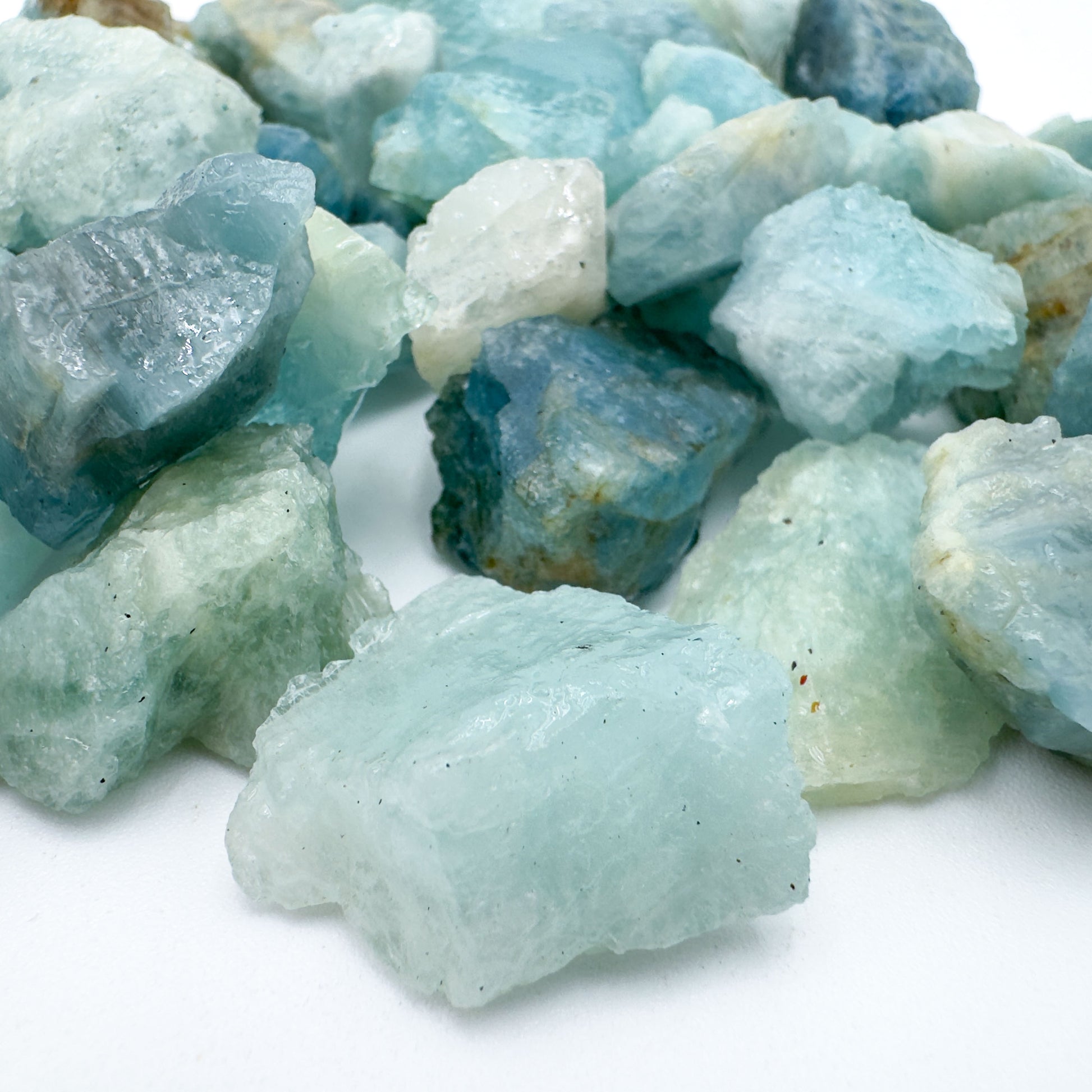 Profile shot of Aquamarine raw stone, hand-selected from Minas Gerais, Brazil, carried for Calm.