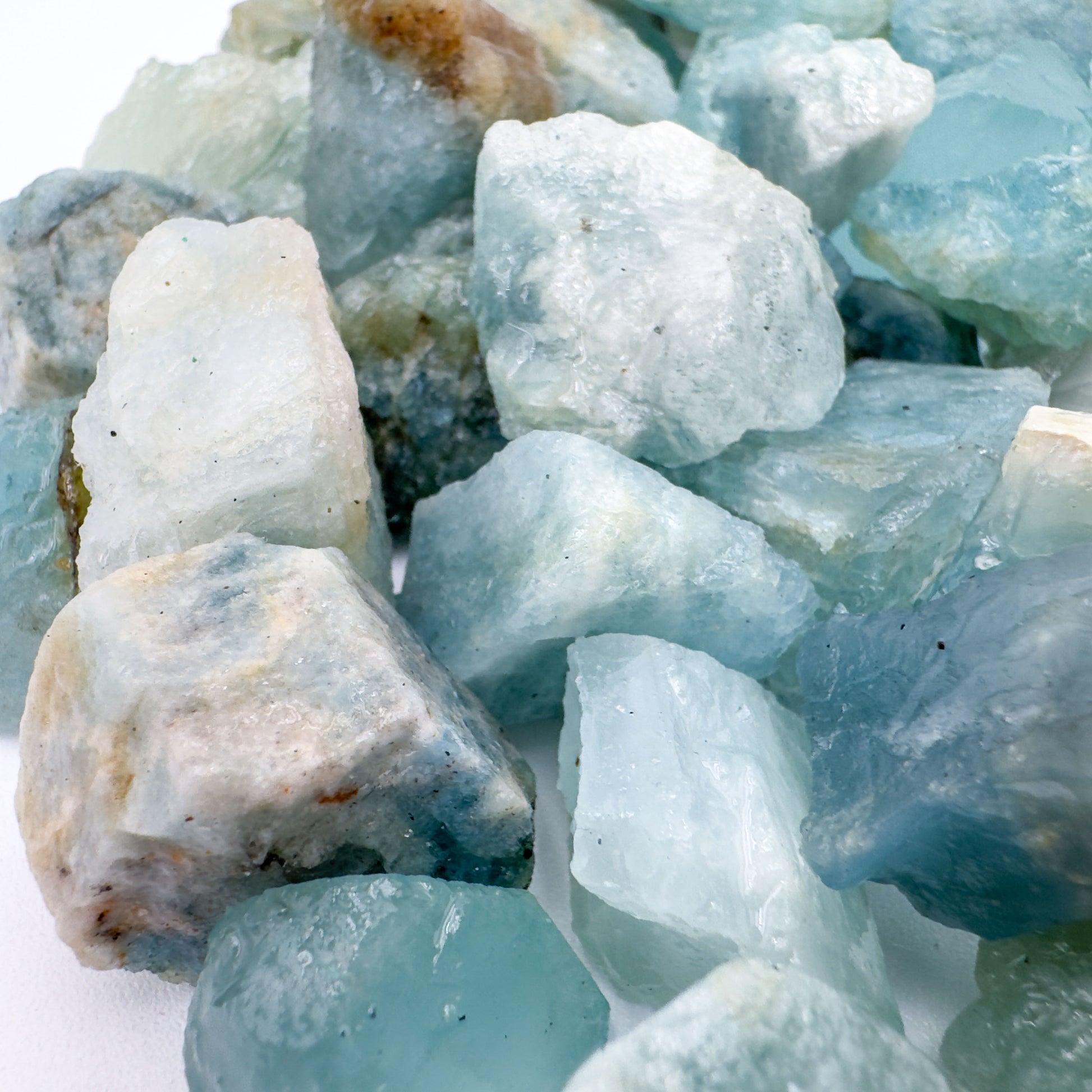 Plan view of Aquamarine raw stone, often kept for Calm, sourced from Brazil.
