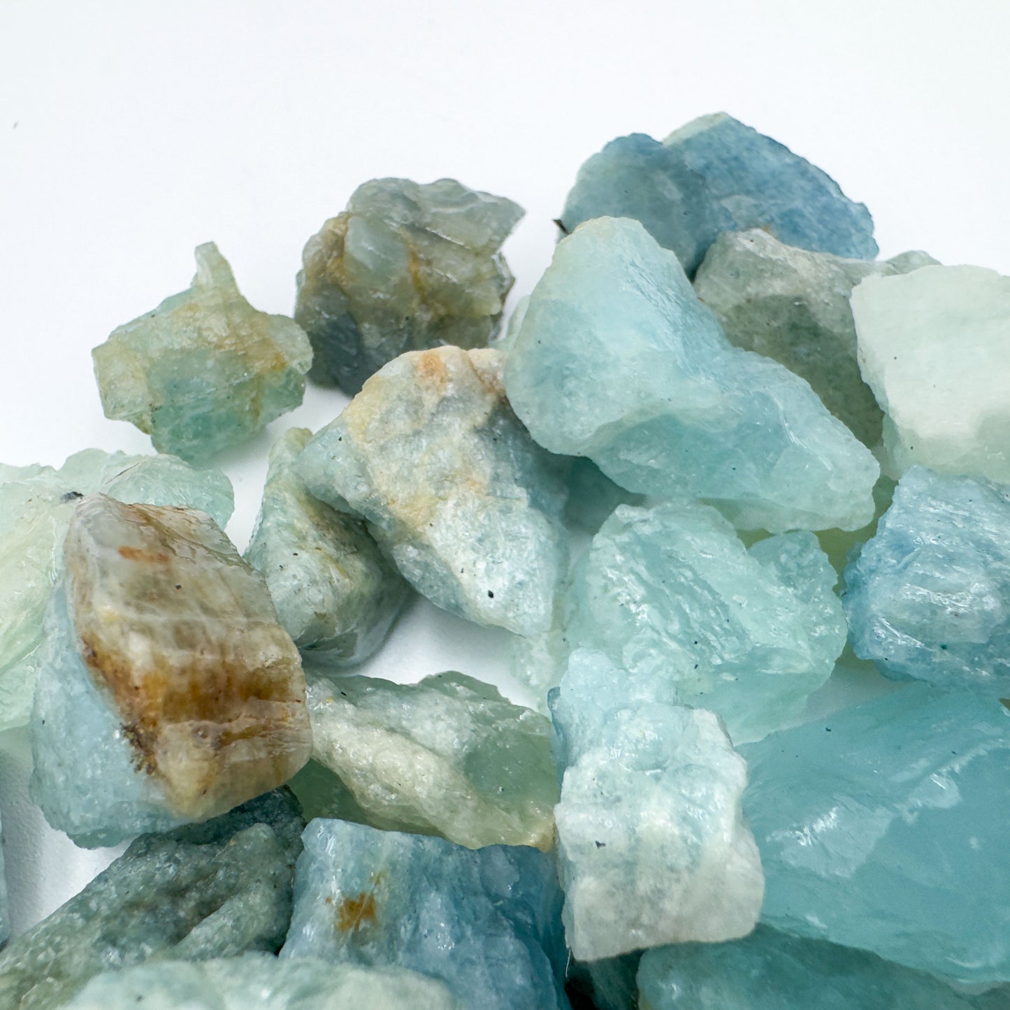 Palm-scale view of a Aquamarine raw stone, hand-selected from Minas Gerais, Brazil.