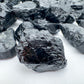 Overhead angle of Black Tourmaline raw stone, from Minas Gerais, Brazil, showing characteristic patterning.