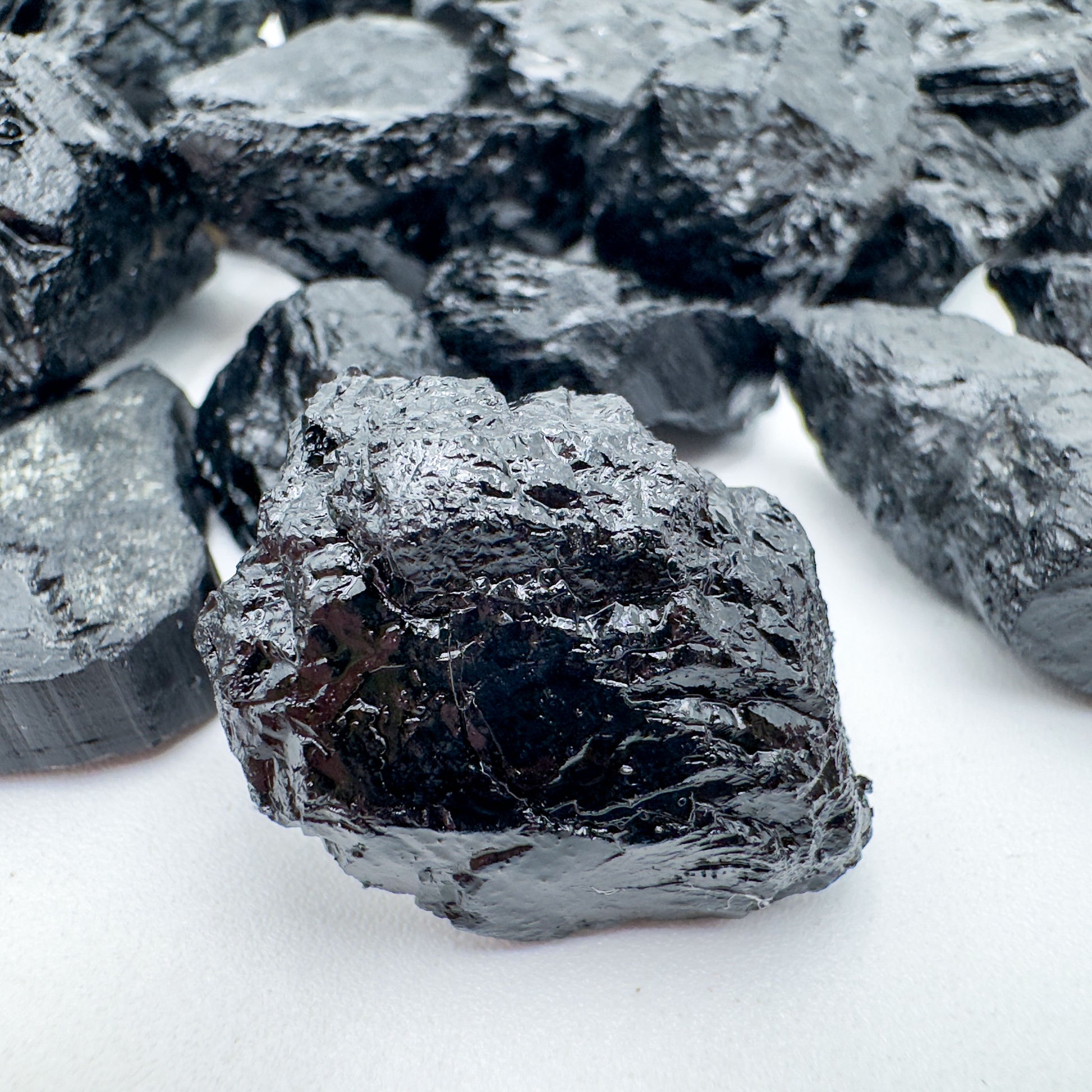 Overhead angle of Black Tourmaline raw stone, from Minas Gerais, Brazil, showing characteristic patterning.