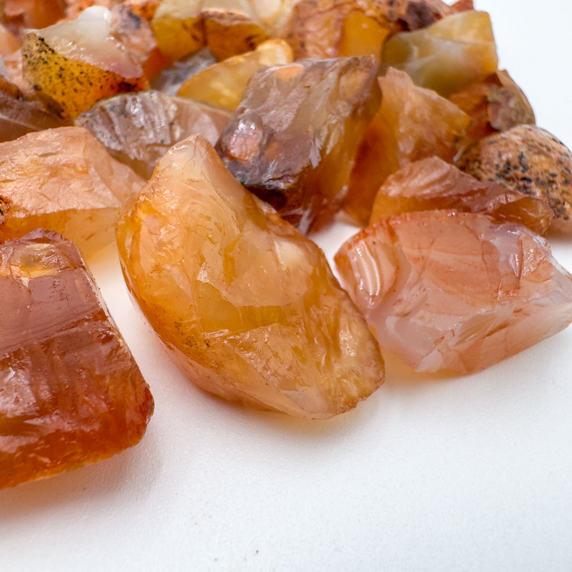 Overhead view of orange Carnelian raw stone, sourced from Rio Grande do Sul, Brazil.