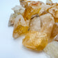 Edge-on view of Golden Healer raw stone, linked to Confidence and Energy, showing characteristic patterning.