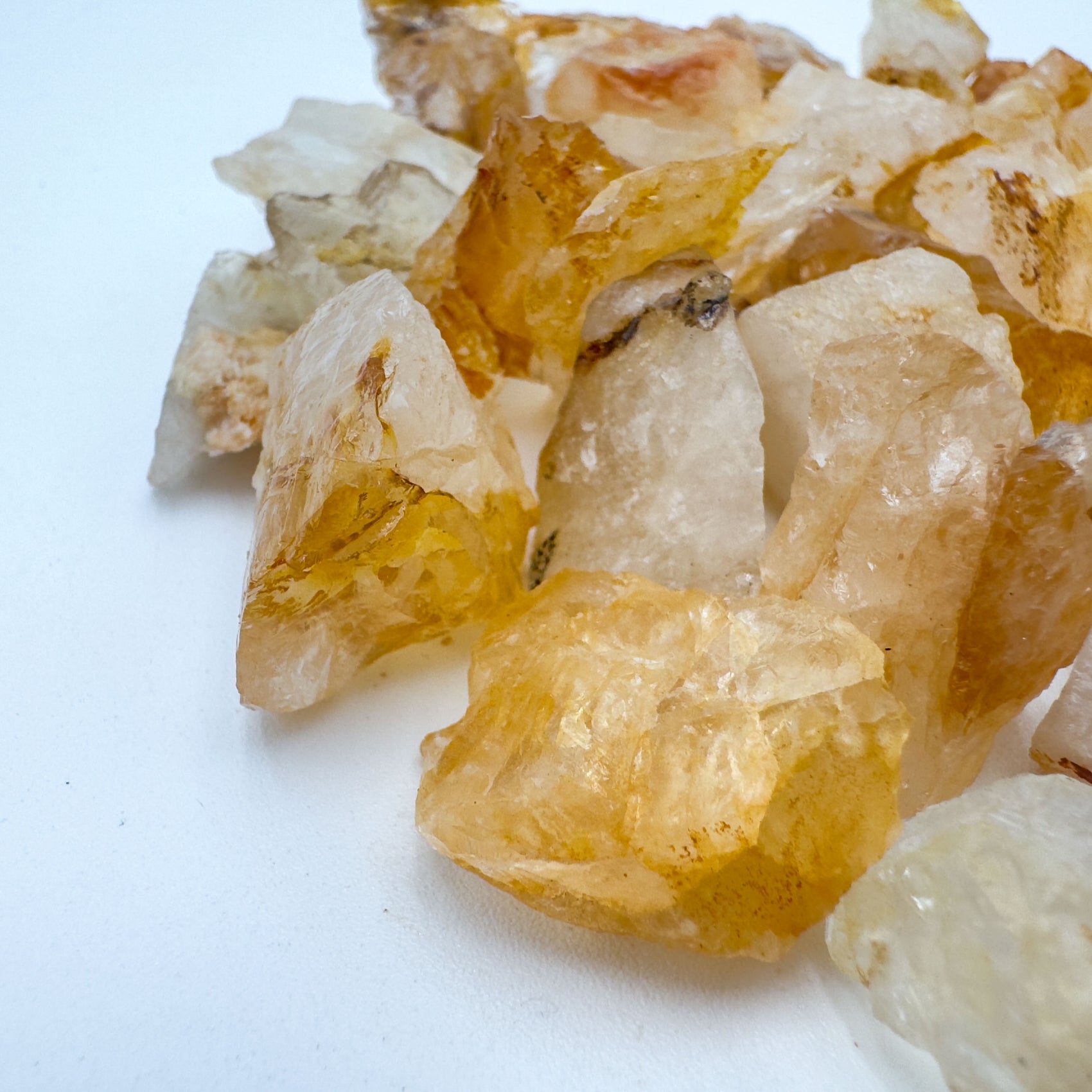 Edge-on view of Golden Healer raw stone, linked to Confidence and Energy, showing characteristic patterning.