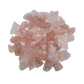 Magnified detail of Rose Quartz raw stone, hand-selected from Minas Gerais, Brazil, showing tight grain.