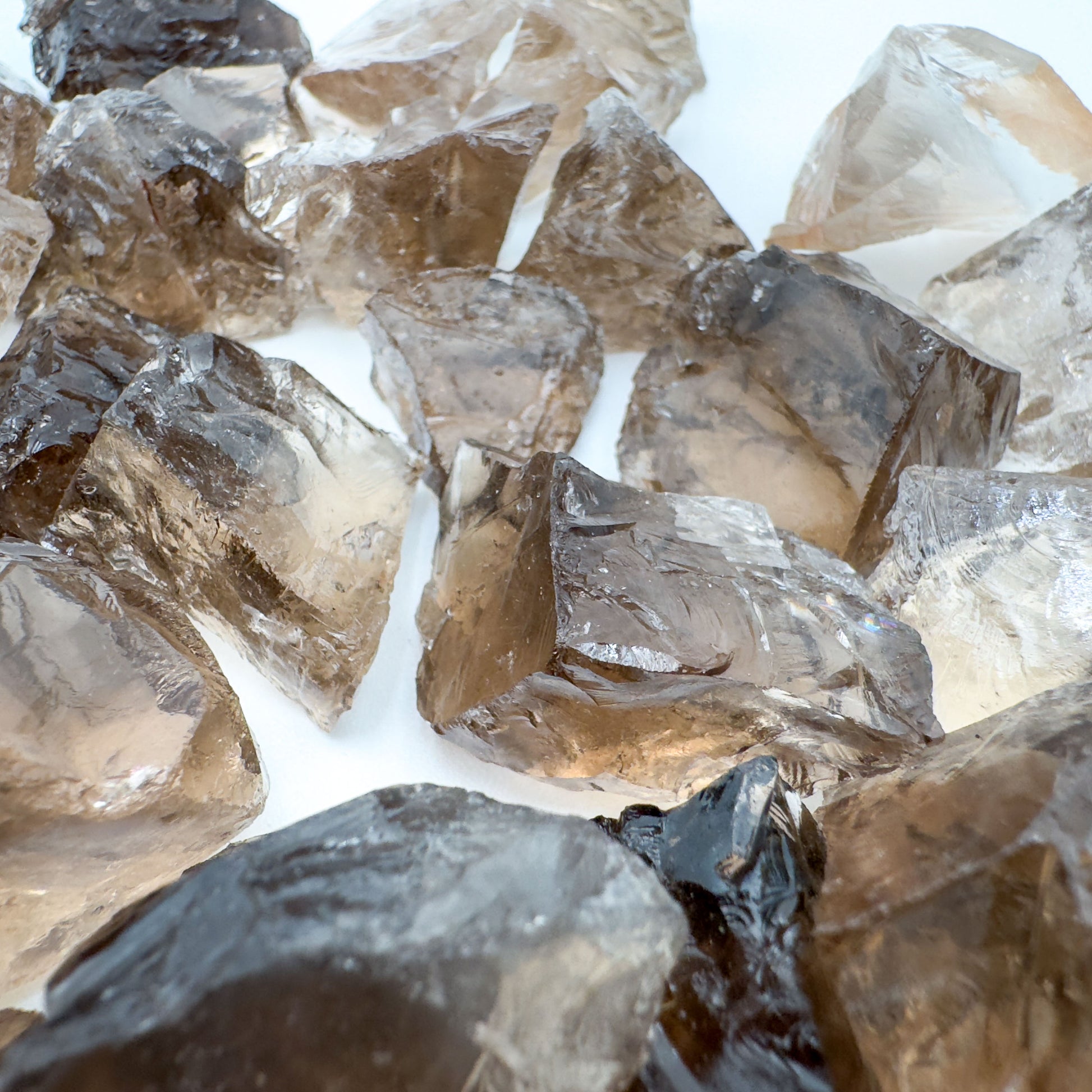 Palm-scale view of a Smoky Quartz raw stone kept near for Grounding.