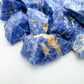 Overhead angle of Sodalite raw stone, sourced from Bahia, Brazil, to support Intuition and Focus.