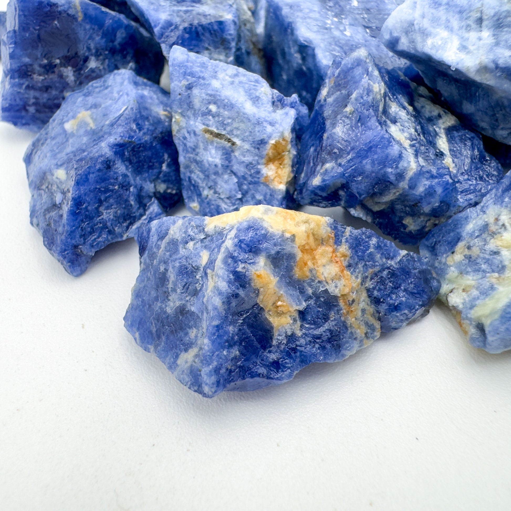 Overhead angle of Sodalite raw stone, sourced from Bahia, Brazil, to support Intuition and Focus.
