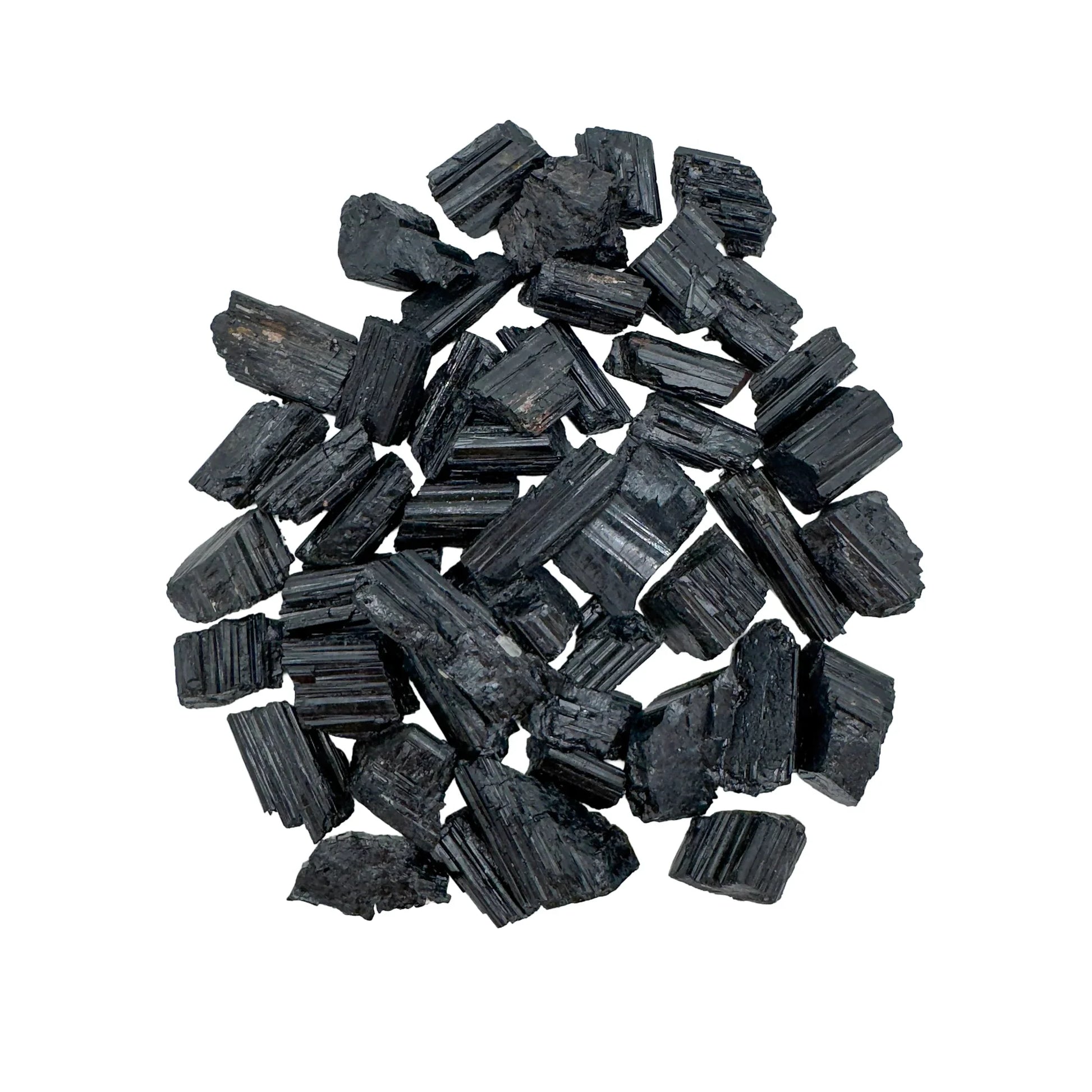 Surface detail of Black Tourmaline raw stone, kept close for Protection and Grounding, sourced from Minas Gerais, Brazil.