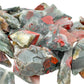 Bulk raw Bloodstone stones piled together, AA grade from Eswatini