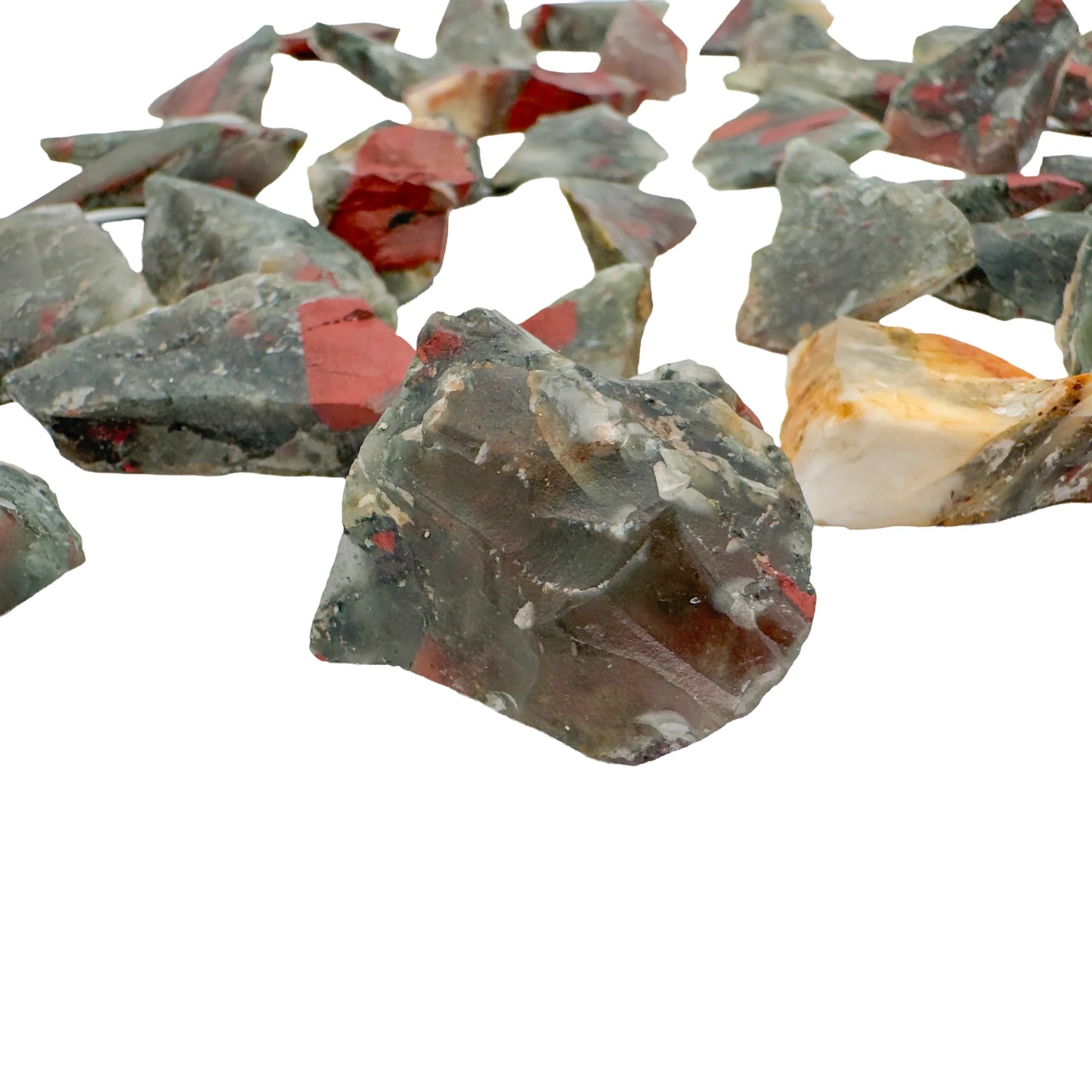 Close-up of raw Bloodstone stones showing green heliotrope with red flecks