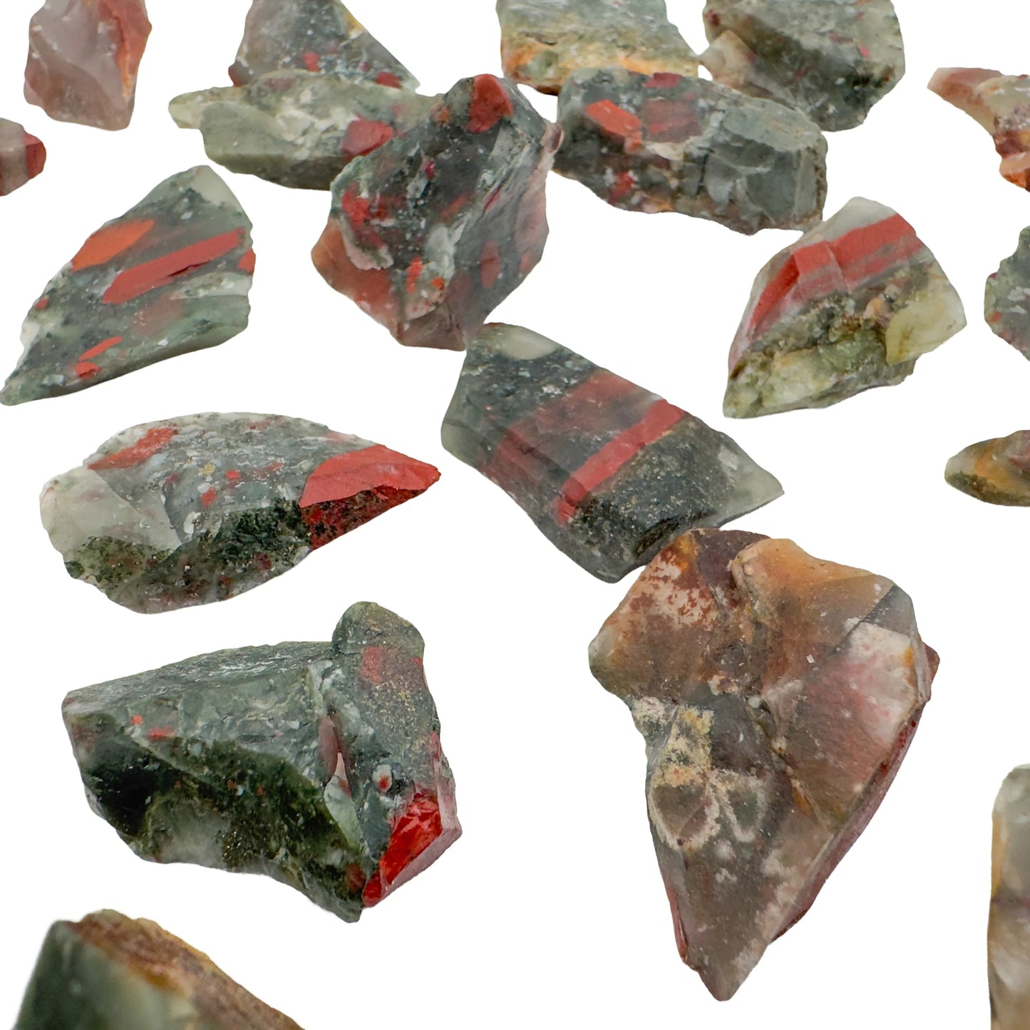 Detail of AA grade raw Bloodstone stones from Eswatini, green with red spots