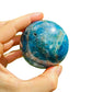 Side perspective of Apatite polished sphere, showing characteristic patterning.