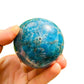 Rear view of Grade AA Apatite polished sphere, for Focus, showing glassy finish.