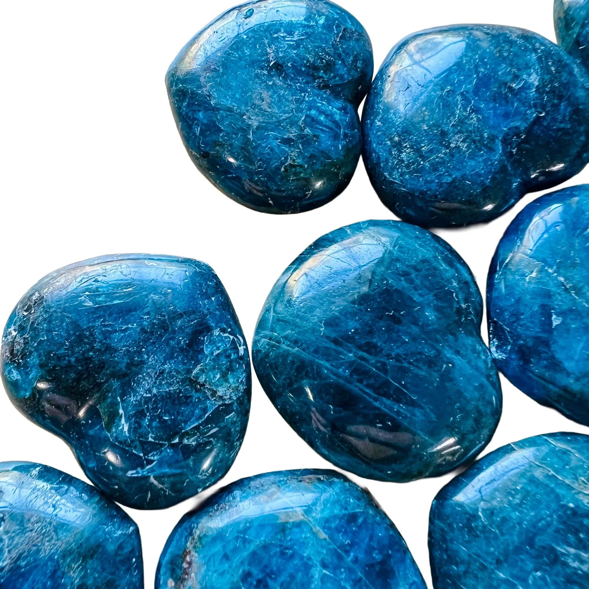 Sideways view of Apatite polished heart, Madagascar-sourced, associated with Focus.