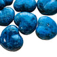 Bird's-eye view of Apatite polished heart, showing soft luster, hand-selected from Anosy, Madagascar.