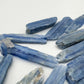 In-hand view of a Blue Kyanite raw stone worked with for Confidence and Meditation.