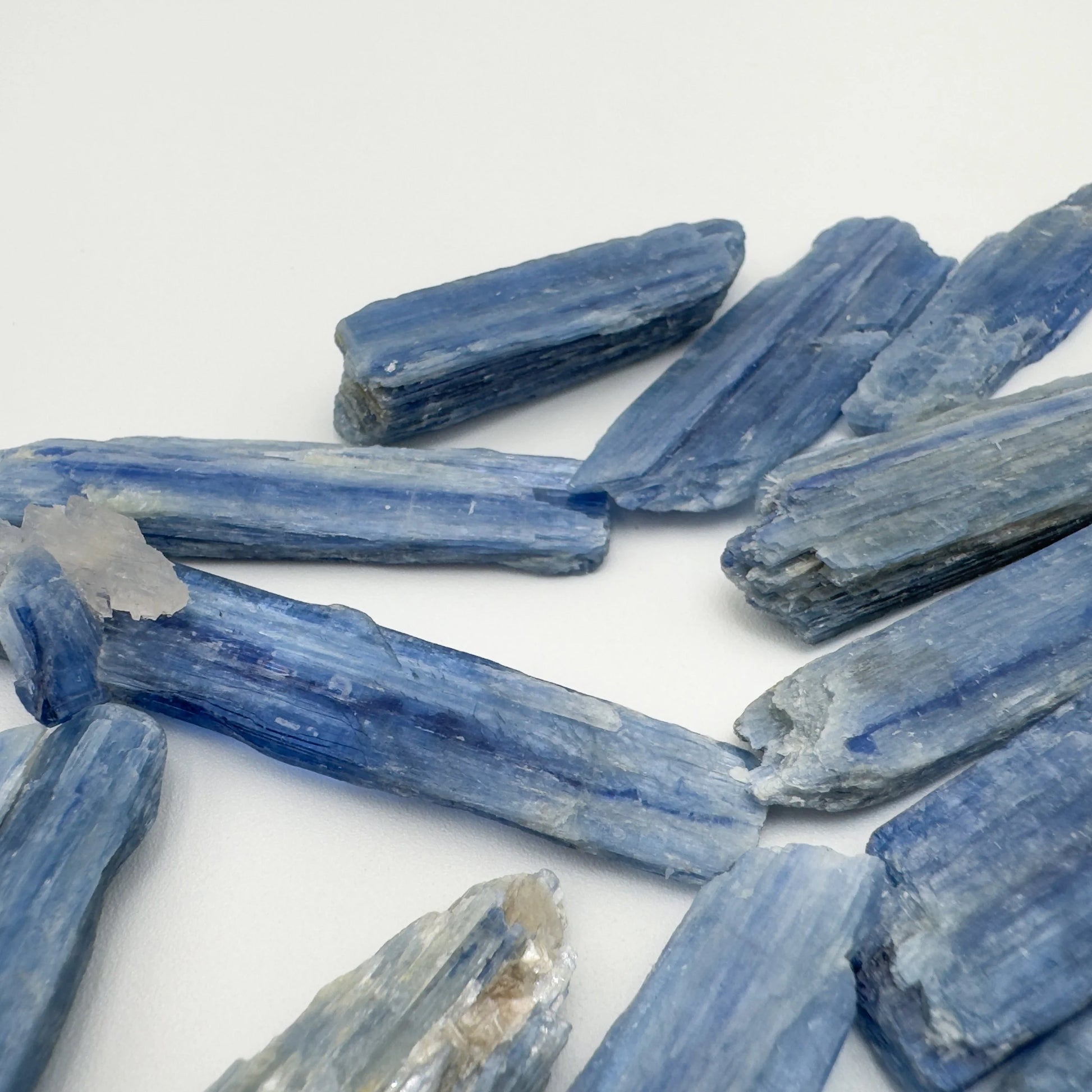 In-hand view of a Blue Kyanite raw stone worked with for Confidence and Meditation.