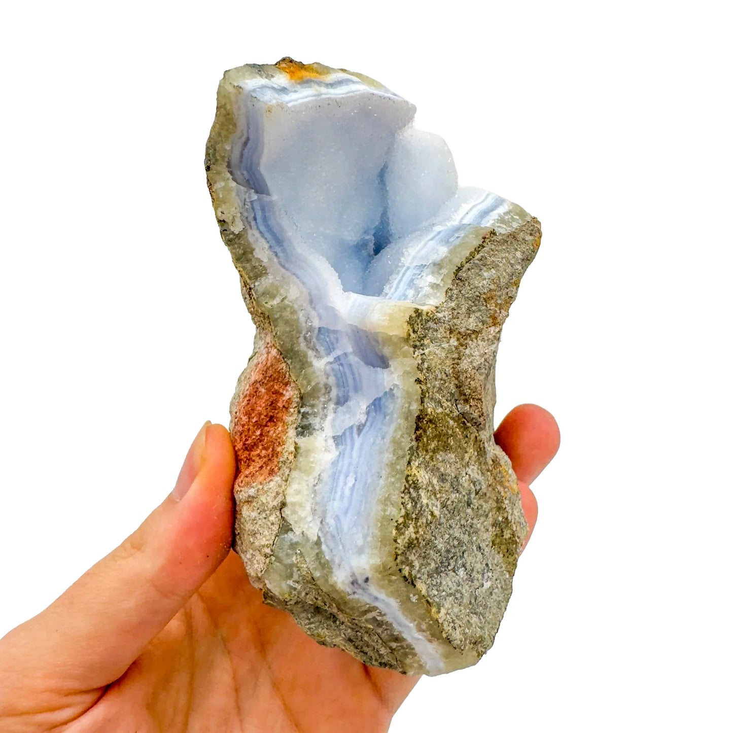 Grade aa blue lace agate geode held in hand for size reference