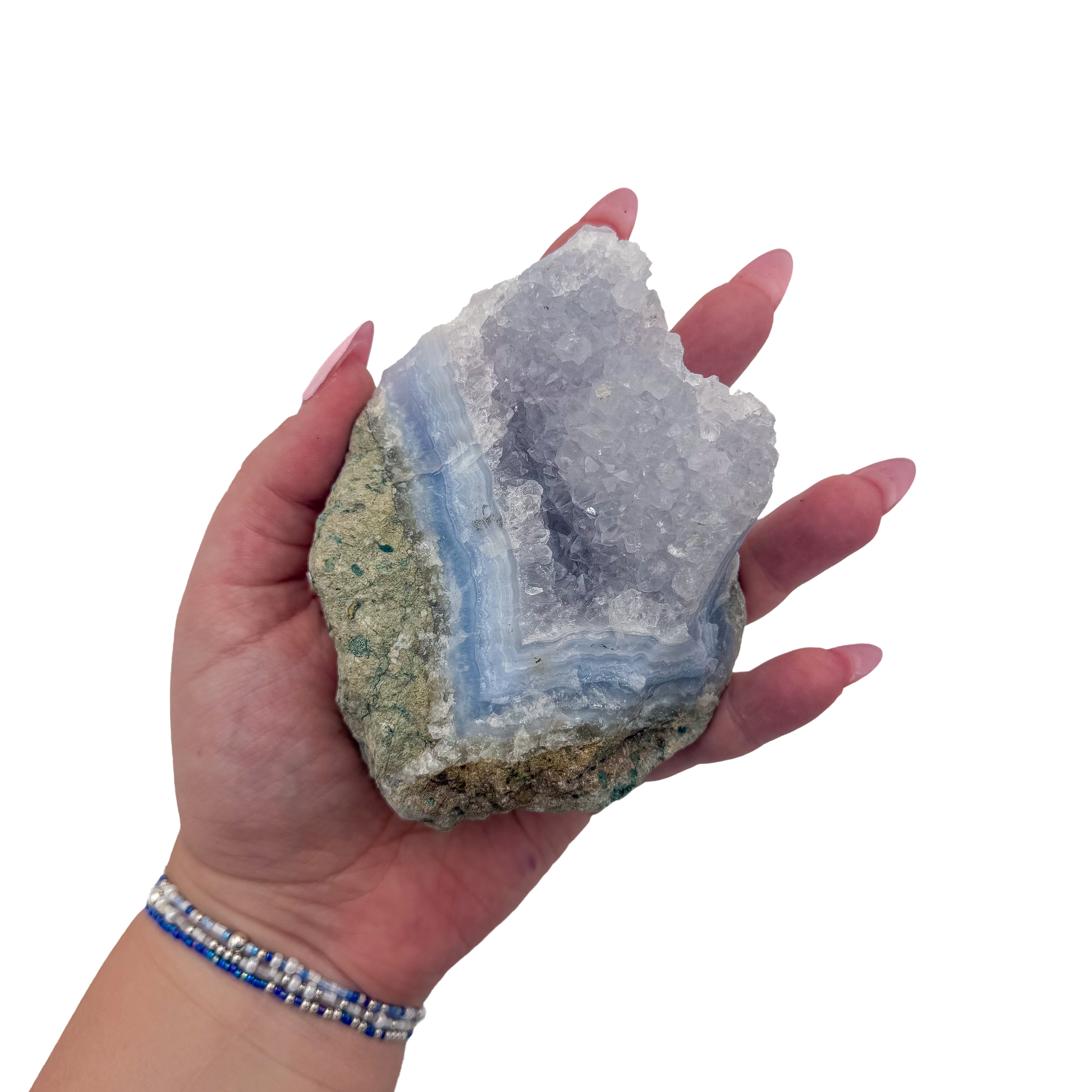 Blue lace agate raw geode held in hand to show scale