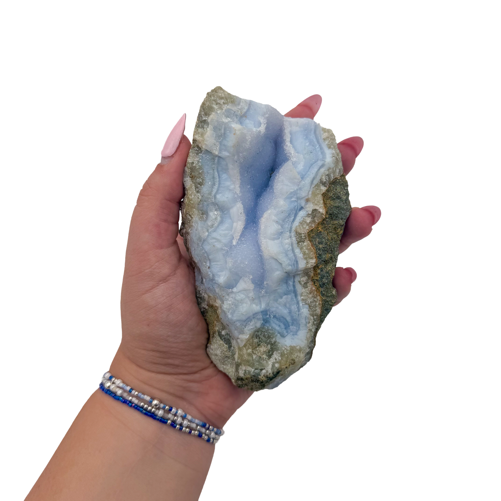Blue lace agate raw geode held in hand to show scale