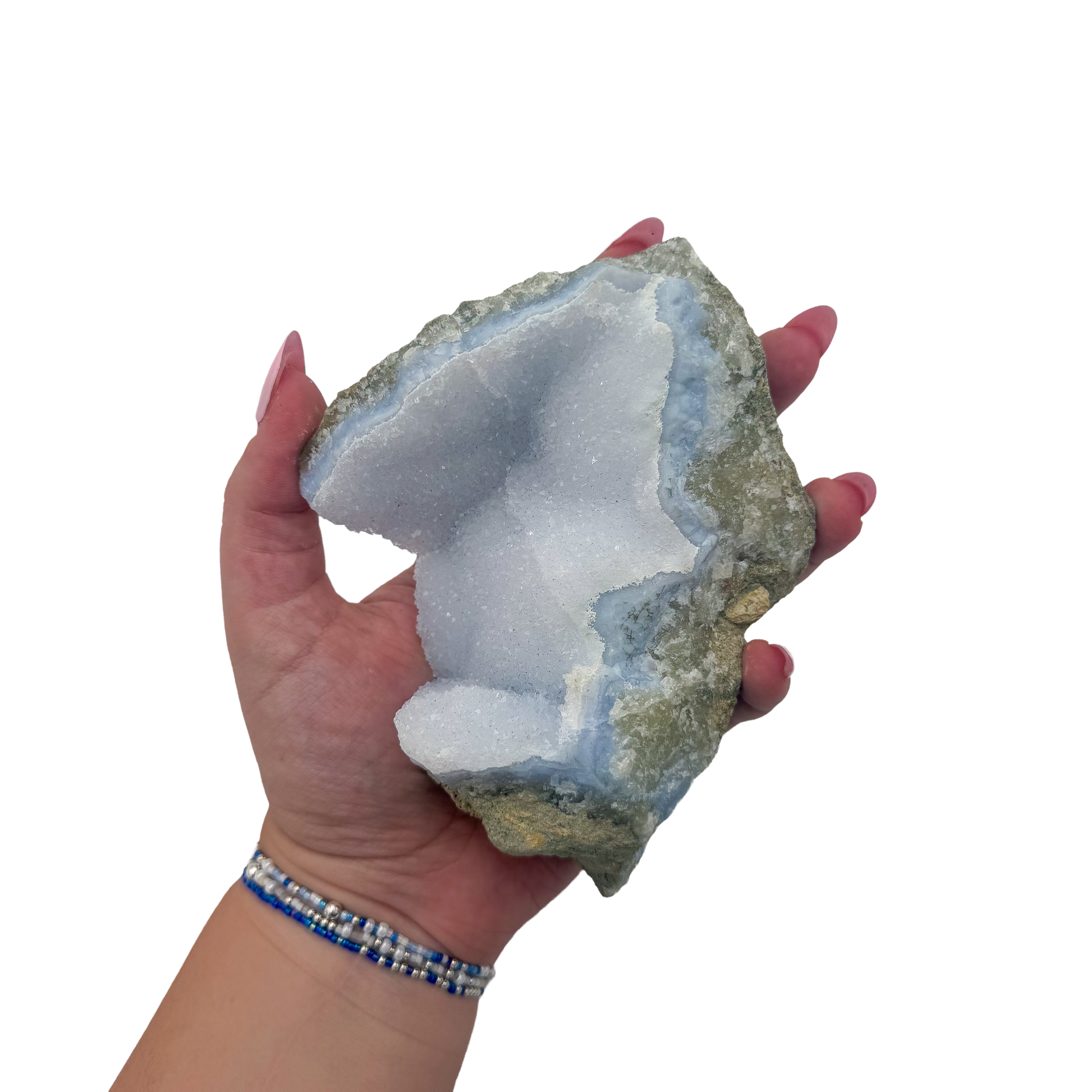 Blue lace agate raw geode held in hand to show scale