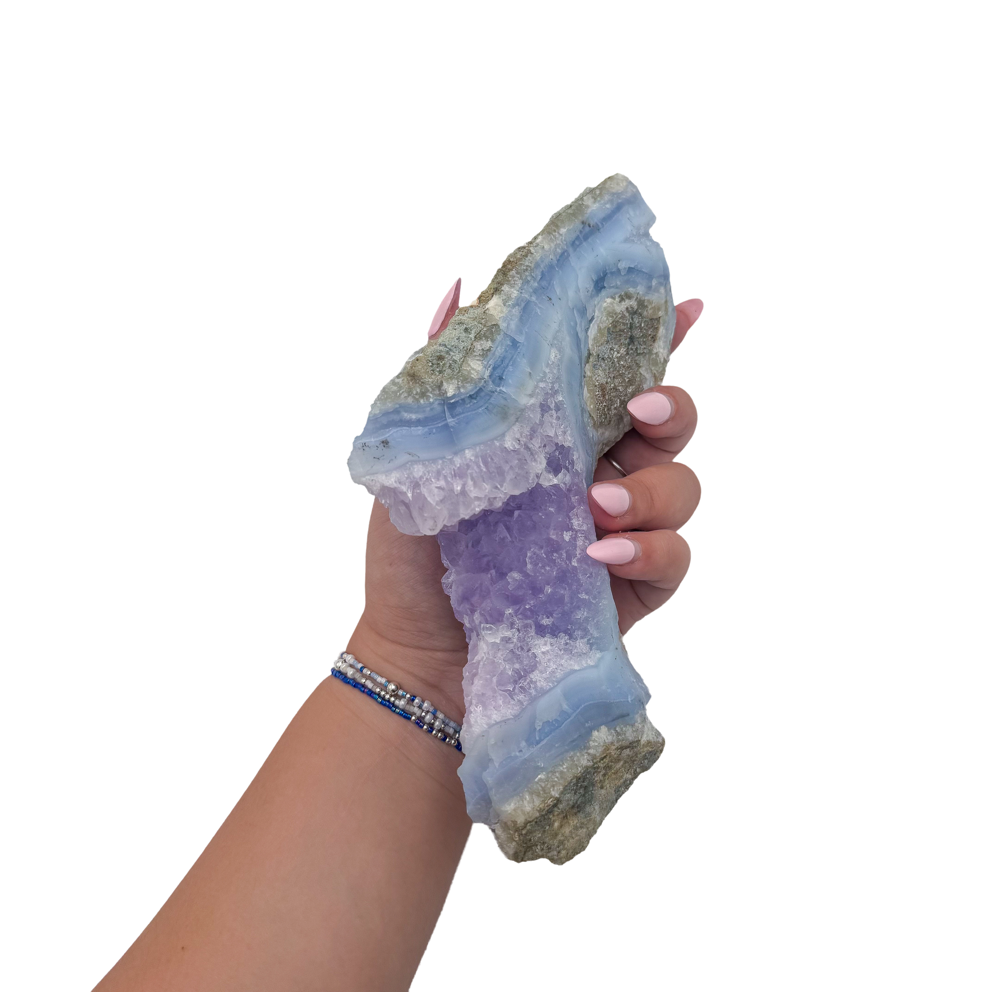 Blue lace agate raw geode held in hand to show scale